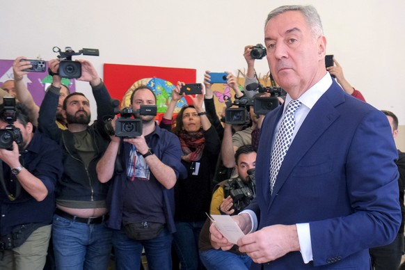 Pro-Western incumbent Milo Djukanovic prepares to vote at a polling station in Montenegro&#039;s capital Podgorica, Sunday, April 2, 2023. Montenegrins are casting ballots on Sunday in a runoff presid ...