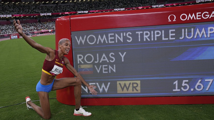 Yulimar Rojas, of Venezuela, celebrates after winning the final of the women&#039;s triple jump at the 2020 Summer Olympics, Sunday, Aug. 1, 2021, in Tokyo. (AP Photo/David J. Phillip)