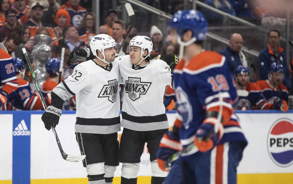 Los Angeles Kings' Kevin Fiala (22) and Jordan Spence (21) celebrate a goal against the Edmonton Oilers during the third period of Game 2 of an NHL hockey Stanley Cup first-round playoff series W ...