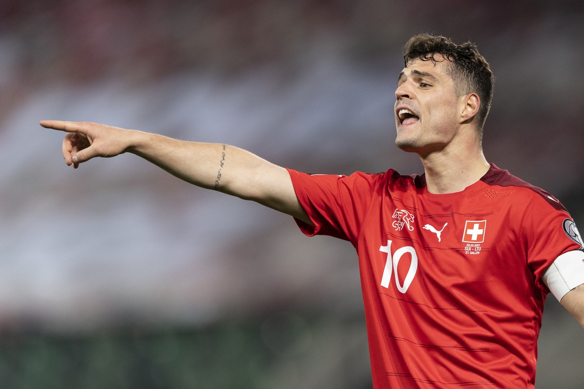 Switzerland's Granit Xhaka gestures during the FIFA World Cup Qatar 2022 qualifying Group C soccer match between Switzerland and Lithuania, at the Kybunpark Stadium in St. Gallen, Switzerland, Su ...