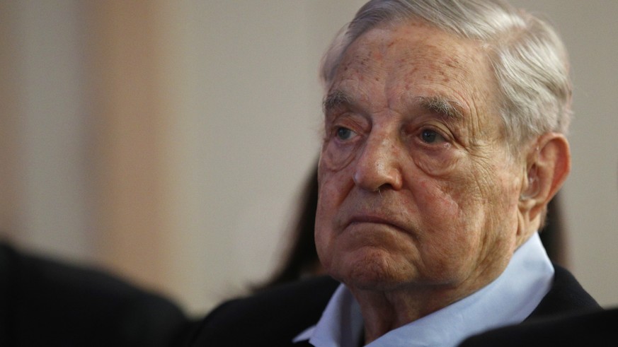 George Soros, Founder and Chairman of the Open Society Foundations listens to the conference after his speech entitled "How to save the European Union" as he attends the European Council On  ...