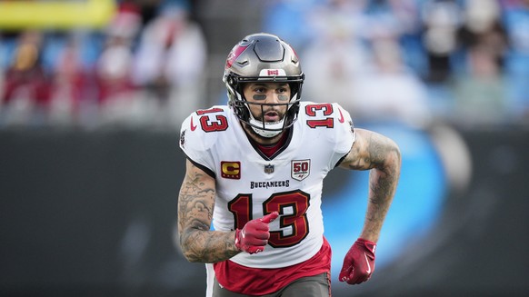 FILE - Tampa Bay Buccaneers wide receiver Mike Evans runs during an NFL football game between the Carolina Panthers and the Tampa Bay Buccaneers on Dec. 21, 2025, in Charlotte, N.C. (AP Photo/Jacob Ku ...