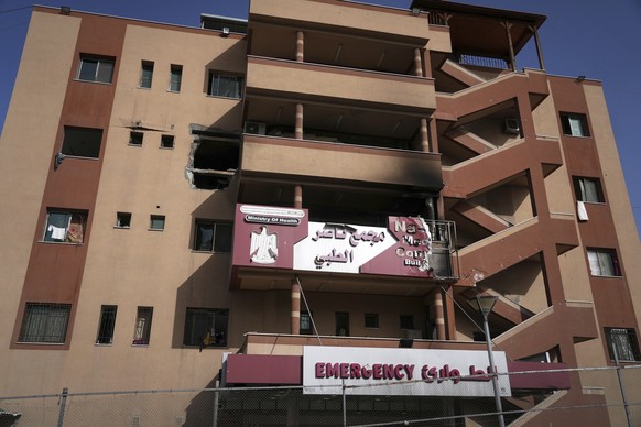 The facade of Nasser Hospital shows damage from an overnight Israeli army strike that killed two patients, in Khan Younis, Gaza Strip, Tuesday, May 13, 2025. (AP Photo/Jehad Alshrafi)
Israel Palestini ...