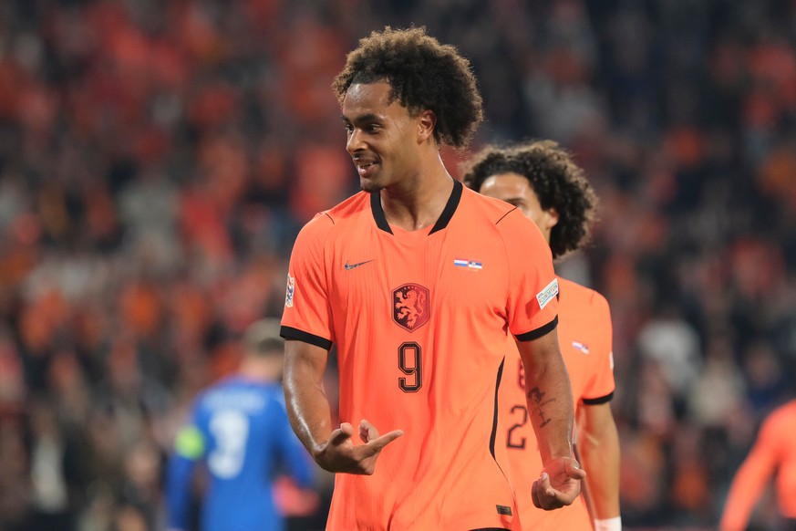 Netherlands' Joshua Zirkzee celebrates after scoring his side's second goal during the Nations League soccer match between Netherlands and Serbia in Eindhoven, Netherlands, Sunday, Oct. 4, 2 ...