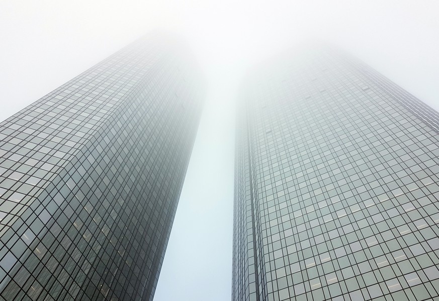 epa08686199 (FILE) - An exterior view of the entrance of the Deutsche Bank corporate headquarters building on a foggy day in Frankfurt am Main, Germany, 21 February 2018 (reissued 21 September 2020). ...