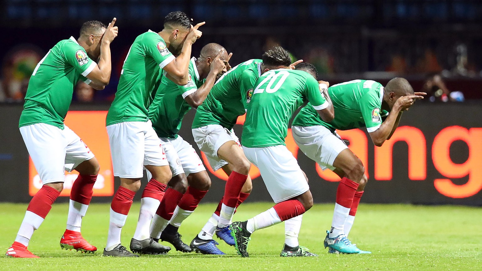 epa07667312 Players of Madagascar celebrate their 1-1 equalizer during the 2019 Africa Cup of Nations (AFCON) group B soccer match between Guinea and Madagascar in Alexandria, Egypt, 22 June 2019. EPA ...