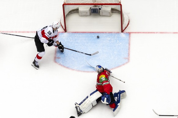 epa12115247 Switzerland&#039;s Timo Meier (L) scores the 0-4 goal against Hungary&#039;s goaltender Adam Vay during the IIHF 2025 World Championship preliminary round group B game between Hungary and  ...
