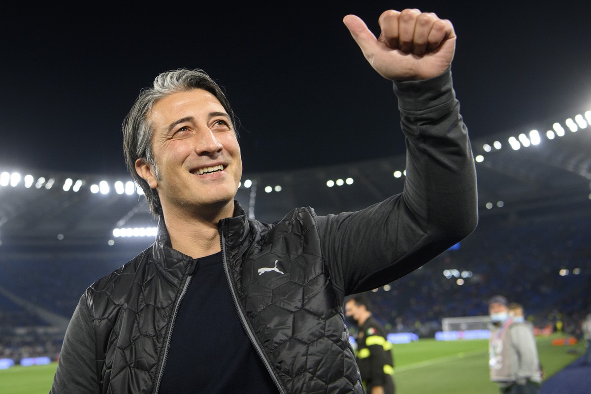 Switzerland's head coach Murat Yakin cheers in front of the Switzerland's supporter before the 2022 FIFA World Cup European Qualifying Group C match between Italy and Switzerland at the Stad ...