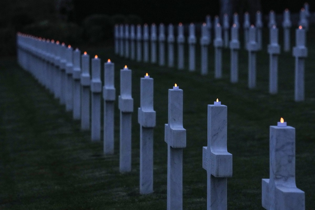 Led lights on grave crosses at the American Cemetery during a ceremony in Suresnes outside Paris, Monday, March 6, 2023. A special candle-lighting ceremony is being held Monday at the Suresnes America ...