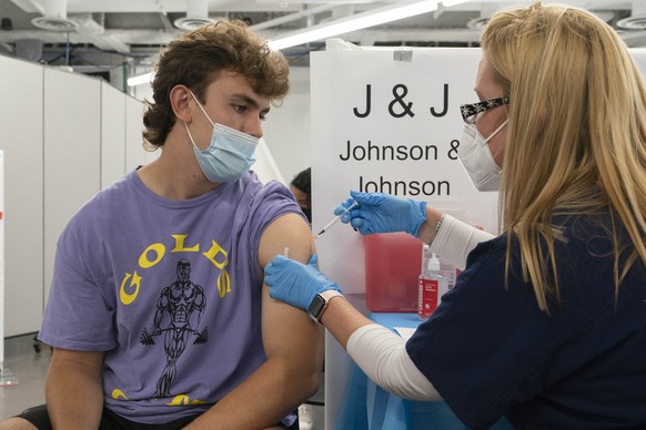 Bradley Sharp, of Saratoga, N.Y., gets the Johnson &amp; Johnson vaccine from registered nurse Stephanie Wagner, Friday, July 30, 2021 in New York. Sharp needs the vaccination because it is required b ...