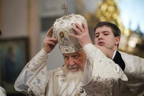 FILE - Patriarch Kirill of the Russian Orthodox Church prepares for an Orthodox Epiphany service at the Epiphany Cathedral in Moscow, Russia, on January 19, 2023. Pope Francis will visit Hungary on the th ...