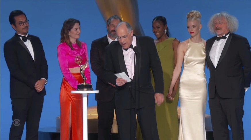 In this video grab issued Sunday, Sept. 19, 2021, by the Television Academy, William Horberg and the cast and crew of &quot;The Queen's Gambit&quot; accept the award for outstanding limited or antholo ...