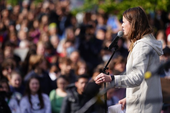 epa10201085 German climate activist Luisa Neubauer speaks during a Global Climate Strike rally of Fridays for Future in Berlin, Germany, 23 September 2022. Fridays for Future demonstrate for a system  ...
