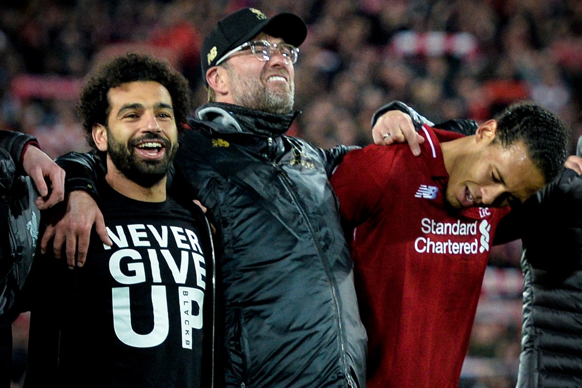 epa07554695 (L-R) Liverpool's Mohamed Salah, head coach Juergen Klopp and Virgil van Dijk celebrate after winning the UEFA Champions League semi final second leg soccer match between Liverpool FC ...