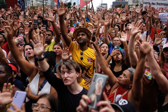 epa12396938 People participate in a demonstration in front of the S