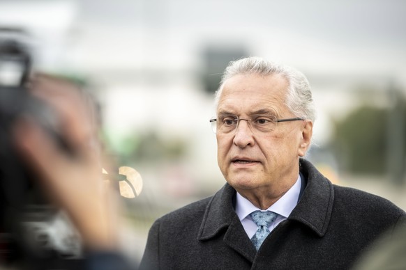 epa08743473 Bavarian Minister of the Interior, Joachim Herrmann, during a visit of a police checkpoint at the motorway A99 in Grasbrunn near Munich, Bavaria, Germany, 14 October 2020. As part of the a ...