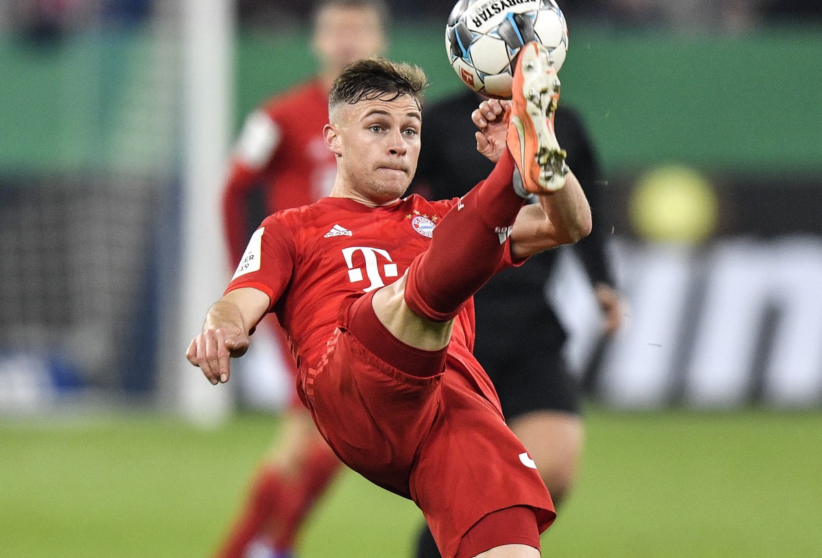 Bayern's Joshua Kimmich plays the ball during the German soccer cup, DFB Pokal, quarter-final match between FC Schalke 04 and Bayern Munich in Gelsenkirchen, Germany, Tuesday, March 3, 2020. (AP  ...
