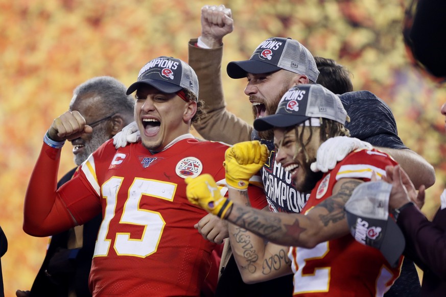 Kansas City Chiefs&#039; Patrick Mahomes (15), Tyrann Mathieu and Travis Kelce celebrate after the NFL AFC Championship football game against the Tennessee Titans Sunday, Jan. 19, 2020, in Kansas City ...