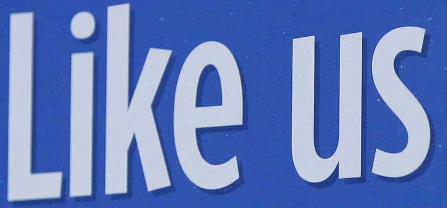 FILE - In this Dec. 13, 2011 file photo, a sign with Facebook&#039;s &quot;Like&quot; logo is posted at Facebook headquarters near the office for the company&#039;s User Operations Safety Team in Menl ...