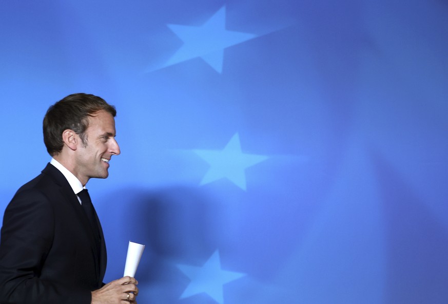 French President Emmanuel Macron arrives for a media conference at an EU summit in Brussels, Friday, Oct. 22, 2021. European Union leaders concluded a two-day summit on Friday in which they discussed  ...