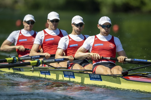 Kai Schaetzle, Patrick Brunner, Tim Roth and Joel Schuerch, from right, from Switzerland at the Men&#039;s Four race at the World Rowing Final Olympic Qualification regatta on Lake Rotsee in Lucerne,  ...