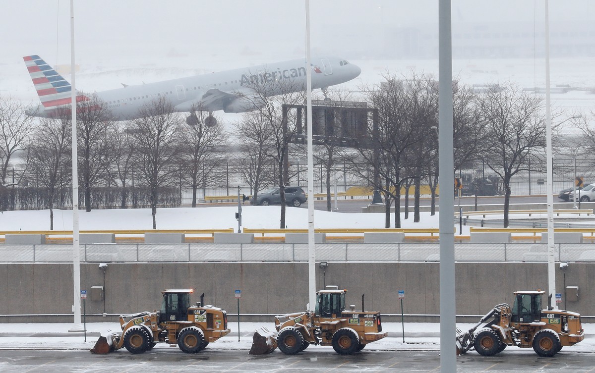 An American Airlines plane departs during the snowstorm at O'Hare International Airport in Chicago, Illinois, U.S., March 13, 2017. Some areas received up to 5 inches of snow, and more than 400 f ...