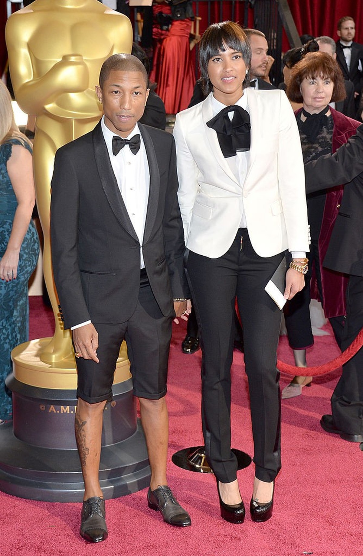 HOLLYWOOD, CA - MARCH 02: Musician Pharrell Williams (L) and wife Helen Lasichanh attend the Oscars held at Hollywood &amp; Highland Center on March 2, 2014 in Hollywood, California. (Photo by Michael ...
