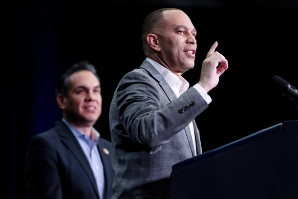 House Minority Leader Hakeem Jeffries, D-N.Y., center, accompanied Democratic Caucus Chair Rep. Pete Aguilar, D-Calif., left, speaks at the House Democratic Caucus Issues Conference at Lansdowne Resor ...