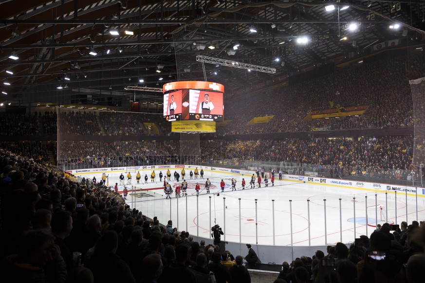 The starting lineups listen to the national anthem prior to the NHL Global Series Challenge ice hockey match between SC Bern and Nashville Predators in Bern, Switzerland, Monday, October 3, 2022 at th ...