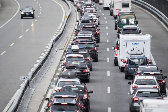 A traffic jam in Erstfeld, Switzerland, in front of the Gotthard tunnel with a length up to 14 kilometres, on Saturday, 14 July 2018. The summer holidays begin this weekend throughout Switzerland and  ...