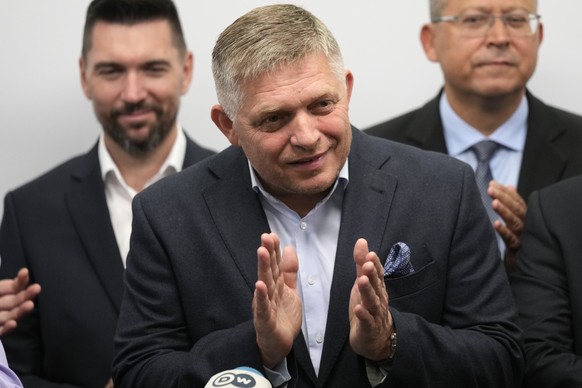 Chairman of Smer-Social Democracy party Robert Fico, center, adresses the results of an early parliamentary election during a press conference in Bratislava, Slovakia, Sunday, Oct. 1, 2023. A populist ...