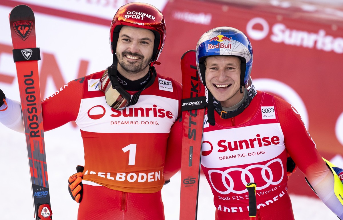 Second placed Loic Meillard of Switzerland, and winner Marco Odermatt of Switzerland pose after the second run of the men's Giant Slalom race at the Alpine Skiing FIS Ski World Cup, in Adelboden, ...