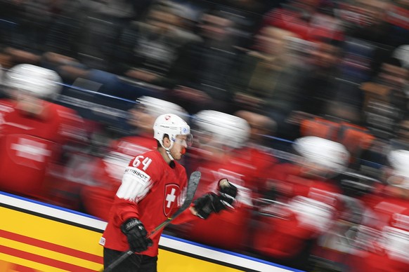 epa07572984 Christoph Bertschy of Switzerland celebrates with teammates after scoring a goal during the IIHF World Championship group B ice hockey match between Switzerland and Norway at the Ondrej Ne ...