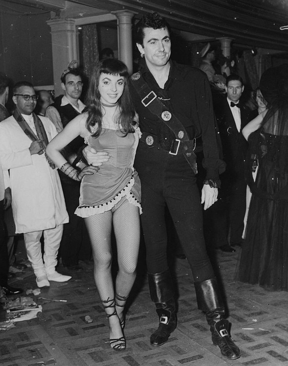 Film stars Joan Collins and Maxwell Read at Chelsea Arts Ball at the Royal Albert Hall, London. (Photo by Fox Photos/Getty Images)