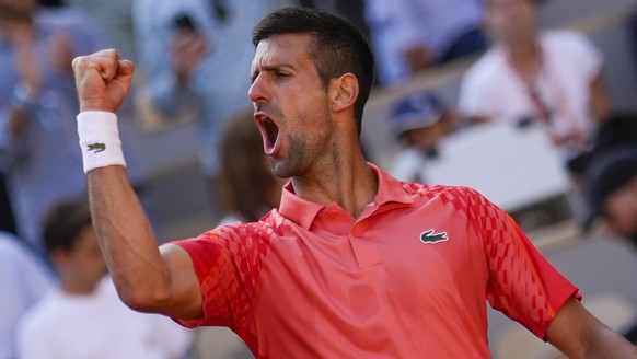 Serbia&#039;s Novak Djokovic celebrates winning his quarterfinal match of the French Open tennis tournament against Russia&#039;s Karen Khachanov in four sets, 4-6, 7-6 (7-0), 6-2, 6-4, at the Roland  ...