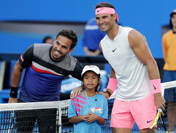 Spain&#039;s Rafael Nadal, right, and Victor Estrella Burgos of the Dominican Republic pose for a photo before their first round match at the Australian Open tennis championships in Melbourne, Austral ...