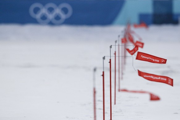 Flag wind speed indicator are waved by a breeze at he shooting range of the Alpensia Biathlon center as the women&#039;s 15km Individual race was canceled due to strong winds at the 2018 Winter Olympi ...