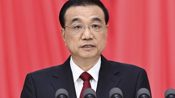 epa10504246 Chinese Premier Li Keqiang delivers a government work report during the opening meeting of the first session of the 14th National People's Congress (NPC) at the Great Hall of the People...