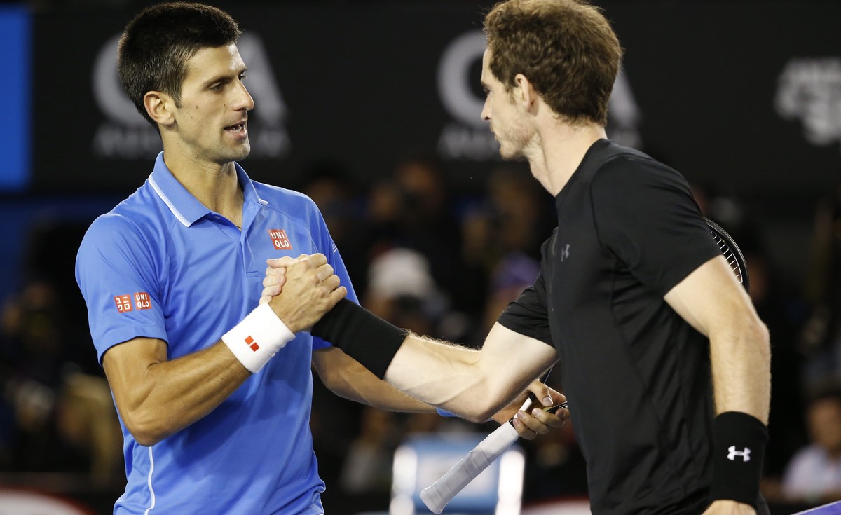 epa04598773 Novak Djokovic (L) of Serbia shakes hands with Andy Murray of Britain after Djokovic won their men's finals match at the Australian Open Grand Slam tennis tournament in Melbourne, Aus ...