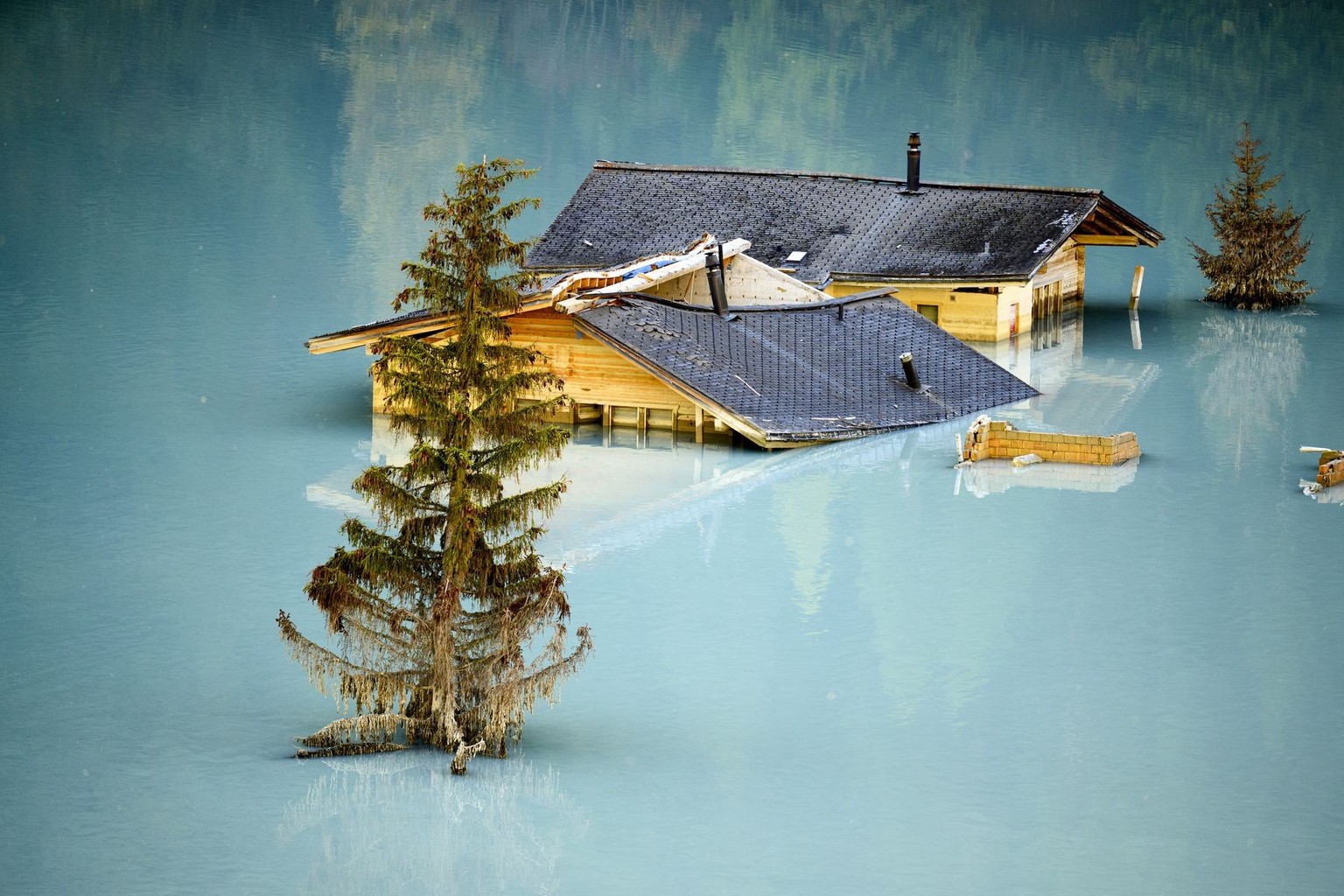 KEYPIX - Destroyed and flooded houses are pictured during the groundbreaking ceremony of reconstruction the village, project "Blatten 2030", 3,5 months after a landslide destroyed the villag ...