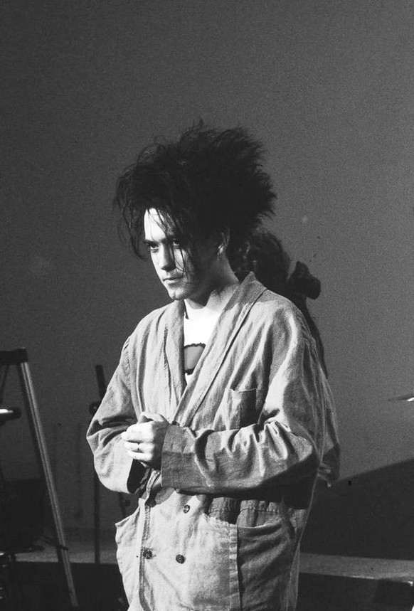 Robert Smith The Cure music live 1985 http://www.radiox.utest.thisisglobal.com/artists/cure/pictures/the-best-lyrics-of-all-time/at-night-1980/