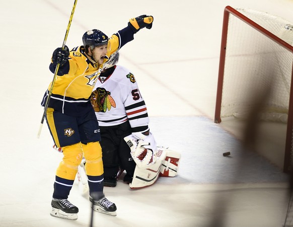 Apr 17, 2015; Nashville, TN, USA; Nashville Predators center Filip Forsberg (9) celebrates after a goal by center Craig Smith (not pictured) during the third period against the Chicago Blackhawks in g ...