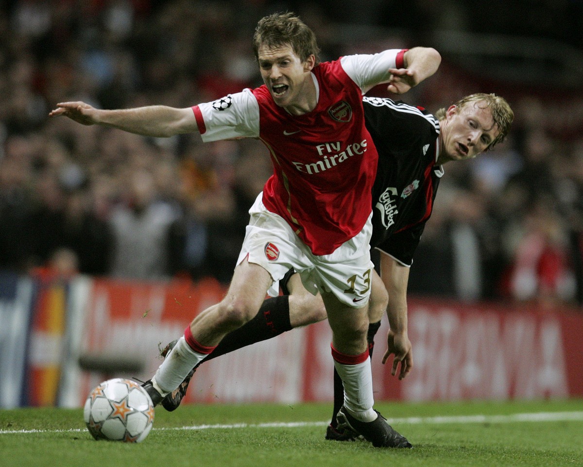 Arsenal's Alexander Hleb, front, gets the ball away from Liverpool's Dirk Kuyt, back, during their Champions League quarterfinal first leg soccer match at Arsenal's Emirates Stadium in  ...
