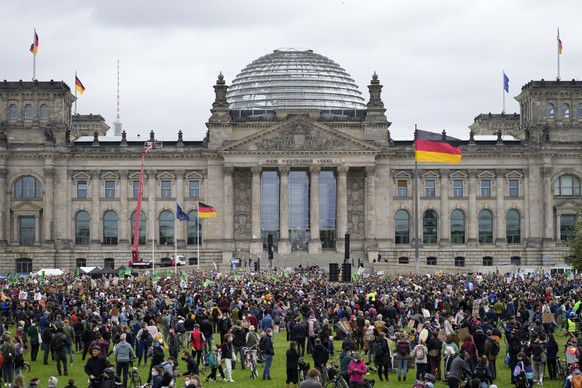 Activist gather for a Fridays for Future global climate strike in front of the parliament building in Berlin, Germany, Friday, Sept. 24, 2021. (AP Photo/Markus Schreiber)