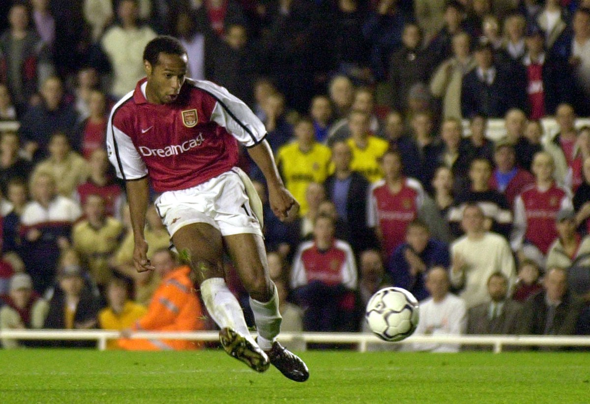 FILE - In this Wednesday Oct. 24, 2001 file photo, Thierry Henry scores Arsenal's third goal against Real Mallorca during their Champions League soccer match played at Highbury, London. Arsene We ...