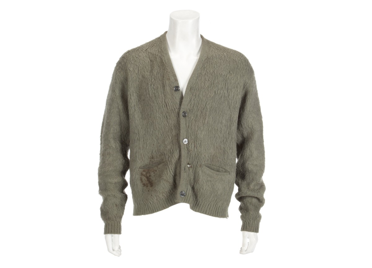 This image released by Julien's Auctions shows an olive green cardigan sweater worn by Nirvana frontman Kurt Cobain during Nirvana's MTV's "Unplugged" performance. The sweater ...
