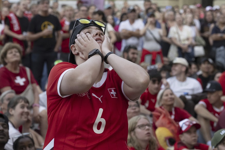 Supporters and fans of Switzerland react as they watch a broadcast of the the Women&#039;s Euro 2025 quarterfinals soccer match between Spain and Switzerland at the Fan Zone public viewing at Bundespl ...