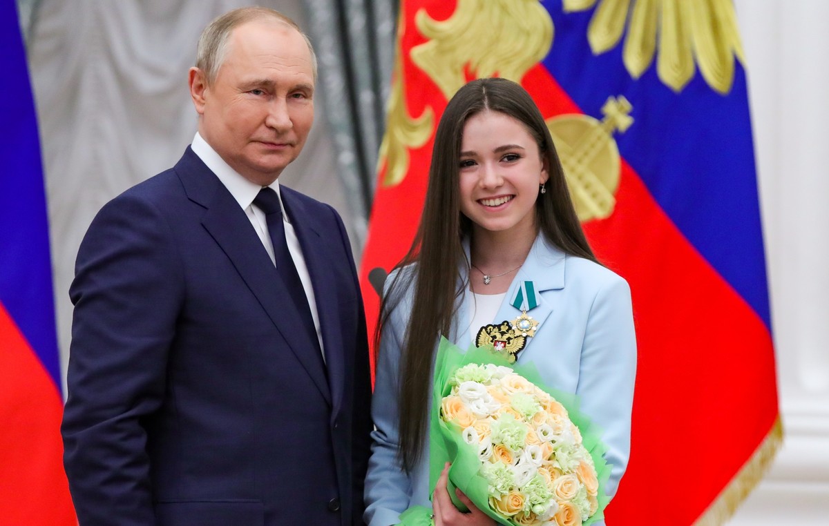 FILE - Russian President Vladimir Putin, left, poses for a photo with Kamila Valieva, a figure skater of the Russian Olympic Committee, in Moscow, Russia, Tuesday, April 26, 2022. The Russian Anti-Dop ...