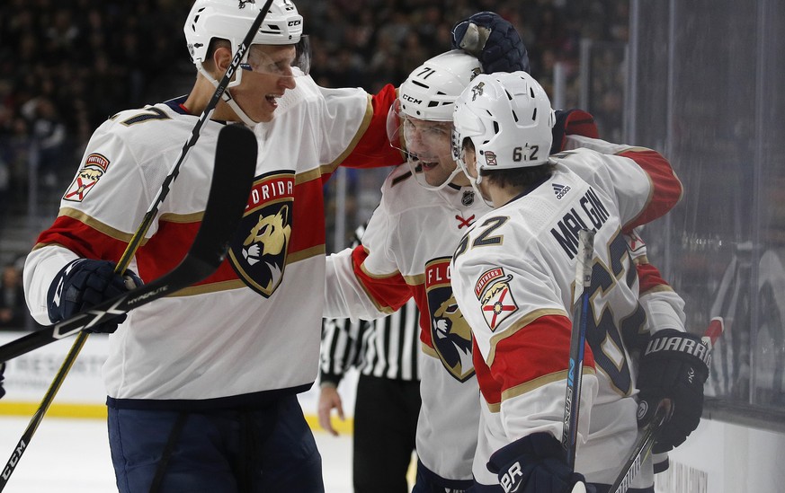 Florida Panthers right wing Radim Vrbata, center, celebrates after scoring against the Vegas Golden Knights with Denis Malgin, right, and Nick Bjugstad during the first period of an NHL hockey game, S ...