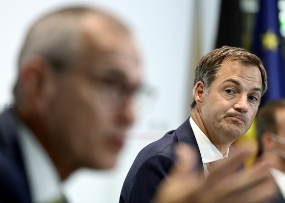 Belgium&#039;s Prime Minister Alexander De Croo, right, listens to Belgium&#039;s Health Minister Frank Vandenbroucke during a media conference, after the meeting of the Federal Consultative Committee ...